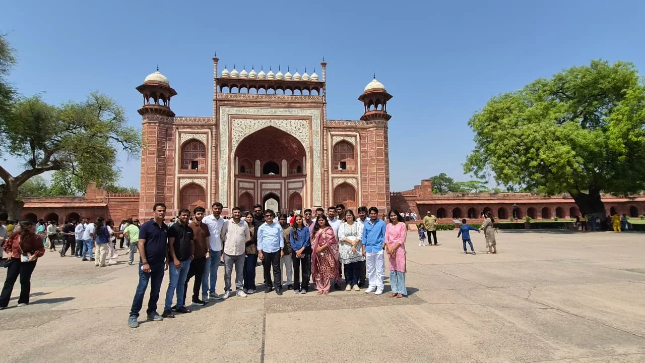 Team photo at monument entrance